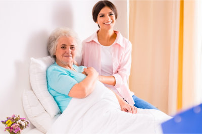 patient and a woman smiling